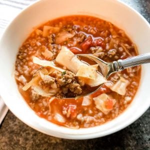 slow cooker gluten free cabbage soup with spoon