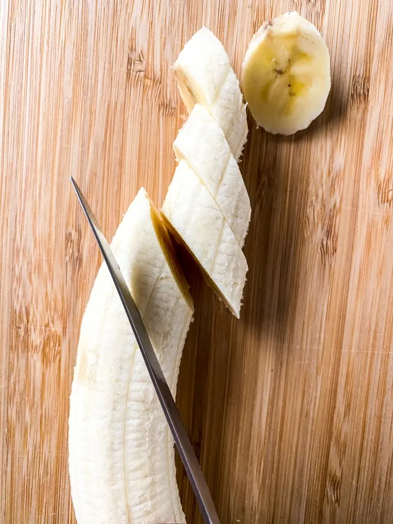 slicing banana with knife