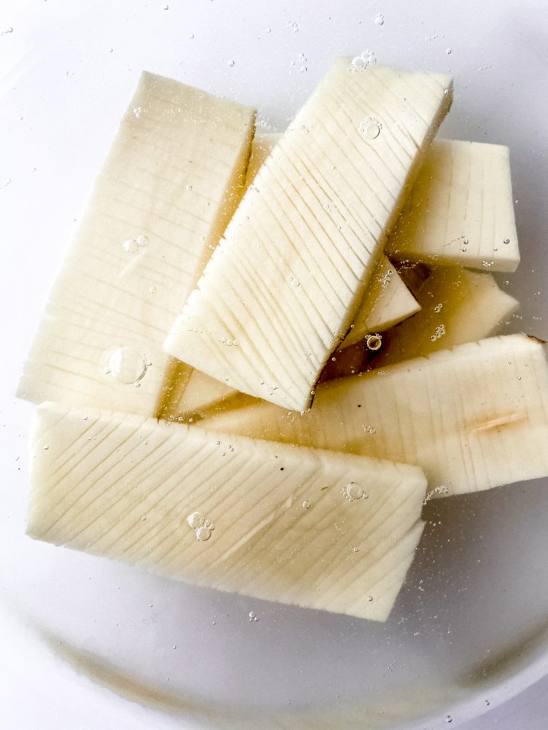 cut potatoes rinsing in cold water