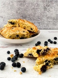 lemon blueberry scones cut and on plate side view