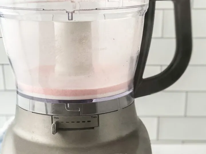 Food processor with pink sanding sugar inside