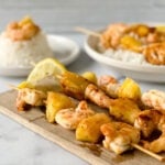 marinated gluten free shrimp and pineapple on skewers and over rice