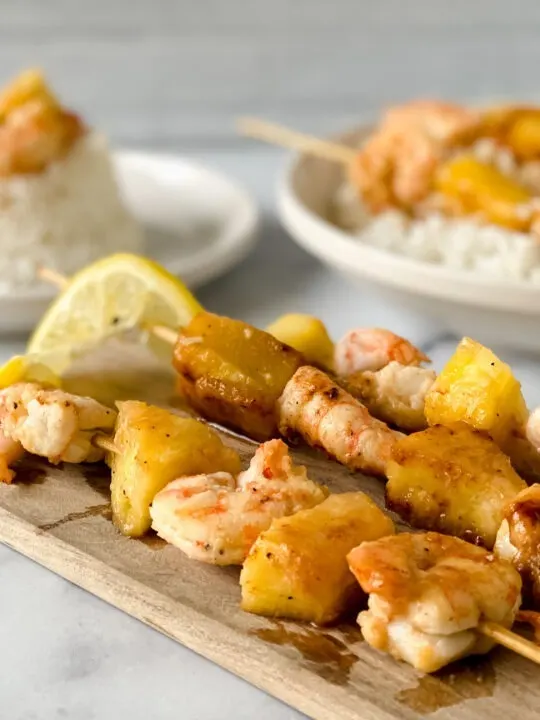 marinated gluten free shrimp and pineapple on skewers and over rice