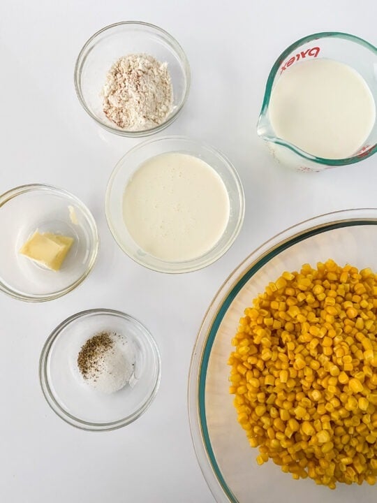 bowl of thawed frozen corn, salt and pepper, butter, heavy cream, milk, and gluten-free flour blend