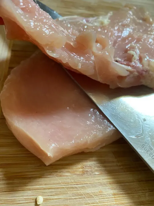 Thinly cutting chicken breast into cutlets
