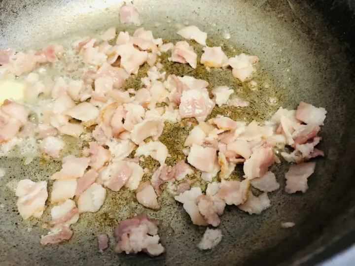 cooking chopped bacon in pan