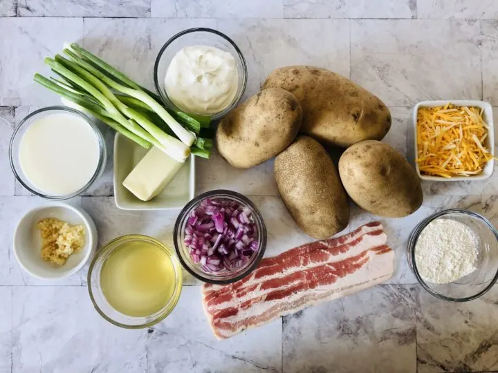 ingredients for gluten free loaded baked potato soup potatoes, cheese, gf flour, bacon, onion, sour cream, milk, butter, garlic