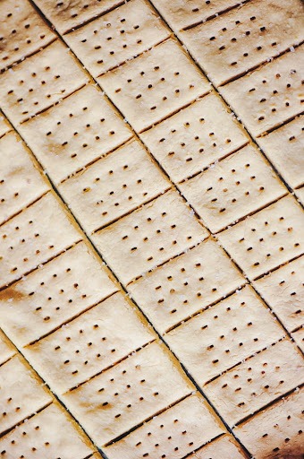 sheet of homemade gluten free vegan sea salt chickpea crackers