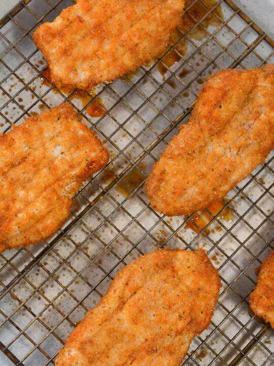 finished pork chops on baking rack coming out of oven