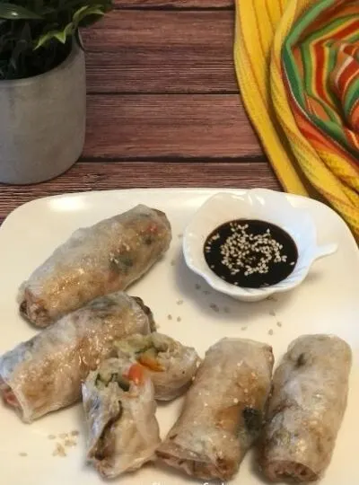 air fryer rice paper spring rolls on plate with gf soy sauce