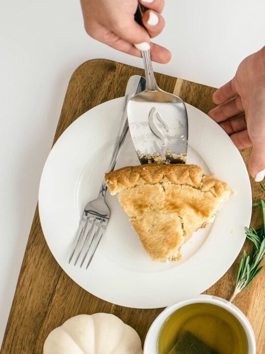 gluten free pie on white plate on wooden board