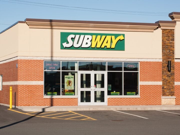 Subway Restaurant with parking lot and blue sky