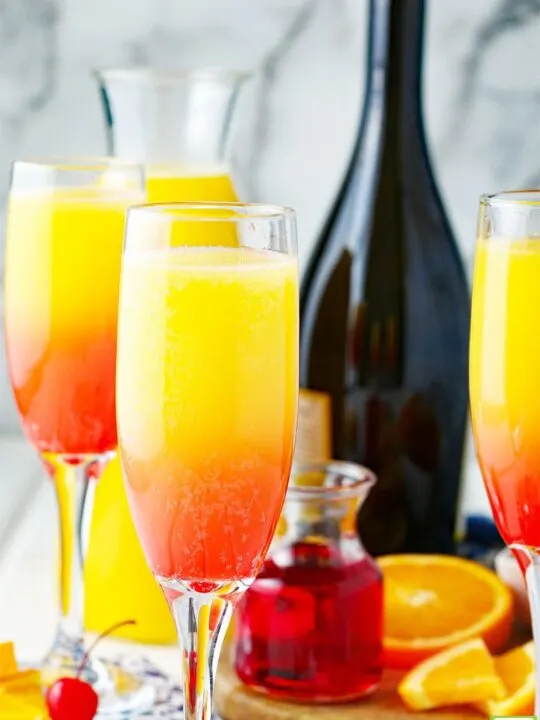 mimosa with orange and cherry and prosecco