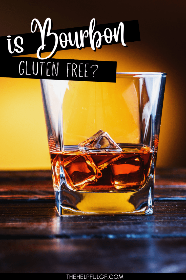 Square glass with bourbon on the rocks sitting on a dark countertop against a yellow shadowed wall and text overlay that says is bourbon gluten free?