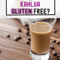 A shot glass filled with kahlua is sitting on a wooden countertop with coffee beans surrounding it and a text overlay with the words Is Kahlua gluten free?