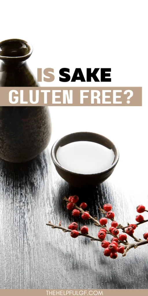 Sitting on a wooden table top is a black porcelain bottle with a matching porcelain cup filled with sake sitting beside a branch with red berries for decoration and a text overlay that reads Is Sake Gluten free