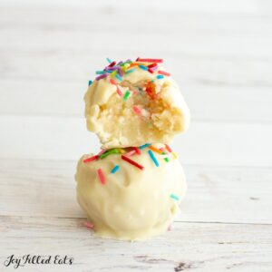 stack of two gluten free cake batter truffles with rainbow sprinkles
