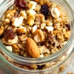gluten free granola with nuts in jar on a tea towel