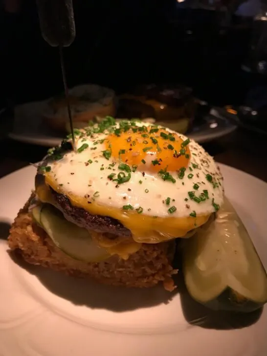 Burger topped with an egg from Au Cheval in Chicago
