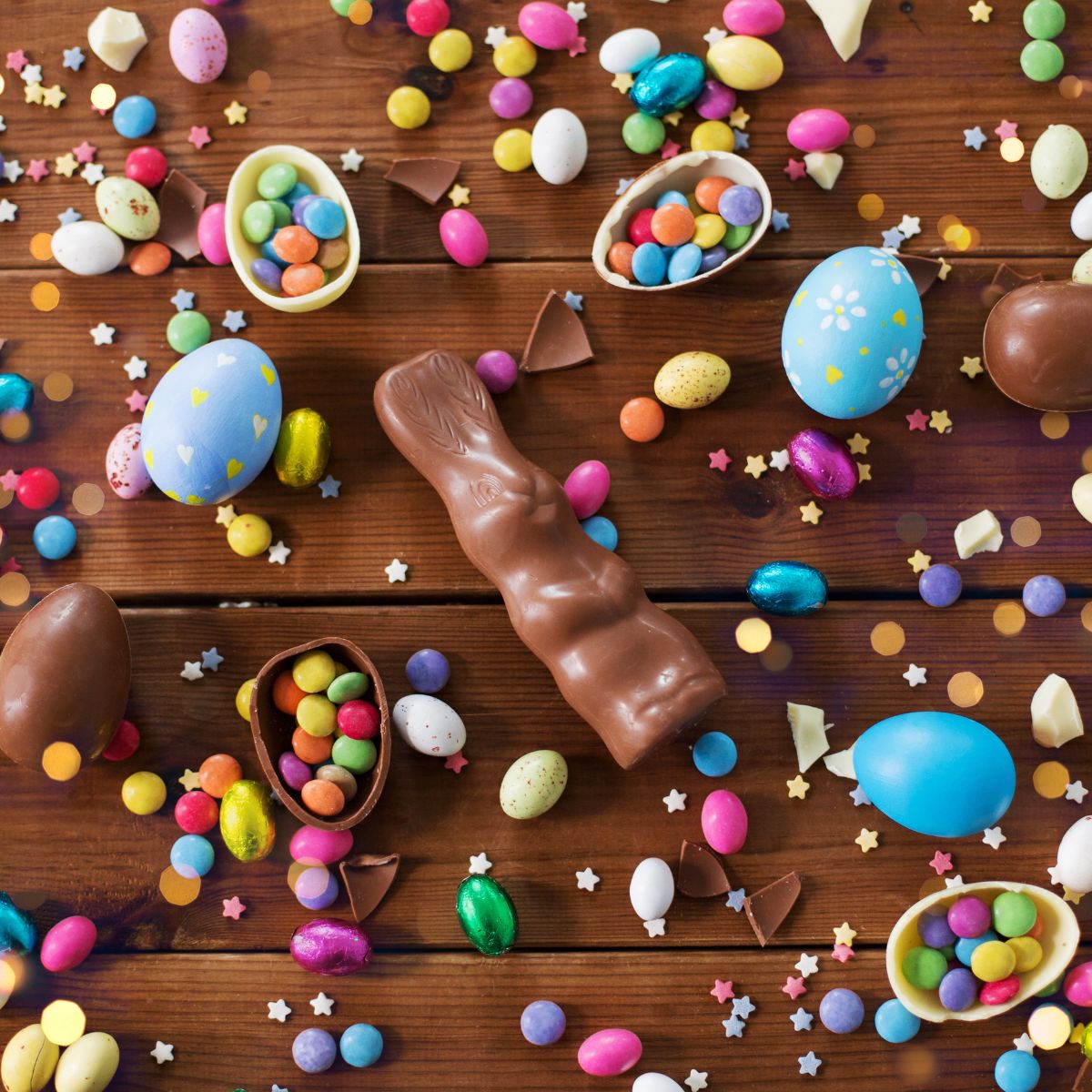 gluten free easter candy scattered on wooden planks