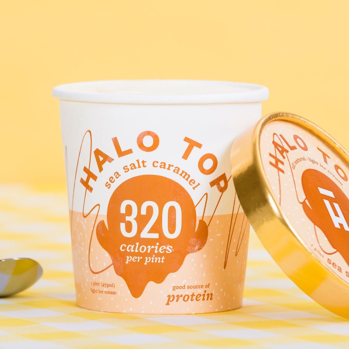 halo top salted caramel ice cream open with yellow background