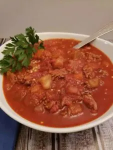eggplant bolognese in bowl with parsley