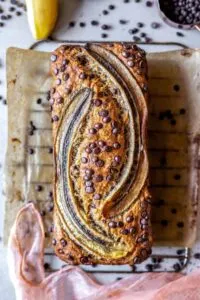 low fodmap banana bread loaf with chocolate chips on baking rack