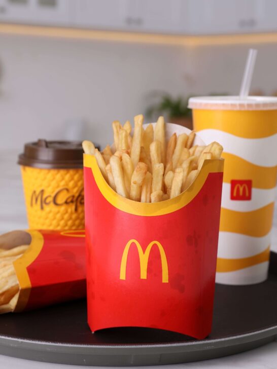 image of mcdonalds fries, coffee, and soda on a tray at a mcdonalds restaurant