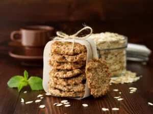 stack of fruity oatmeal cookies wrapped in parchment and tied with twine