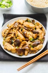 low carb chicken and mushrooms on white plate with chopsticks