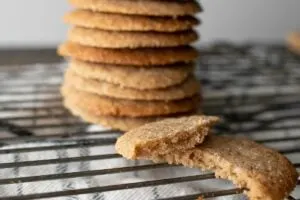 stack of gluten free oat spice cookies on cooling rack