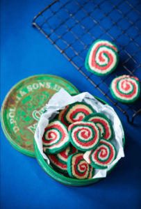 gluten free christmas pin wheel cookies with blue background