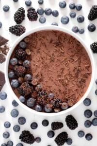 gluten free dairy free chocolate panna cotta recipe made with coconut milk topped with blueberries and blackberries