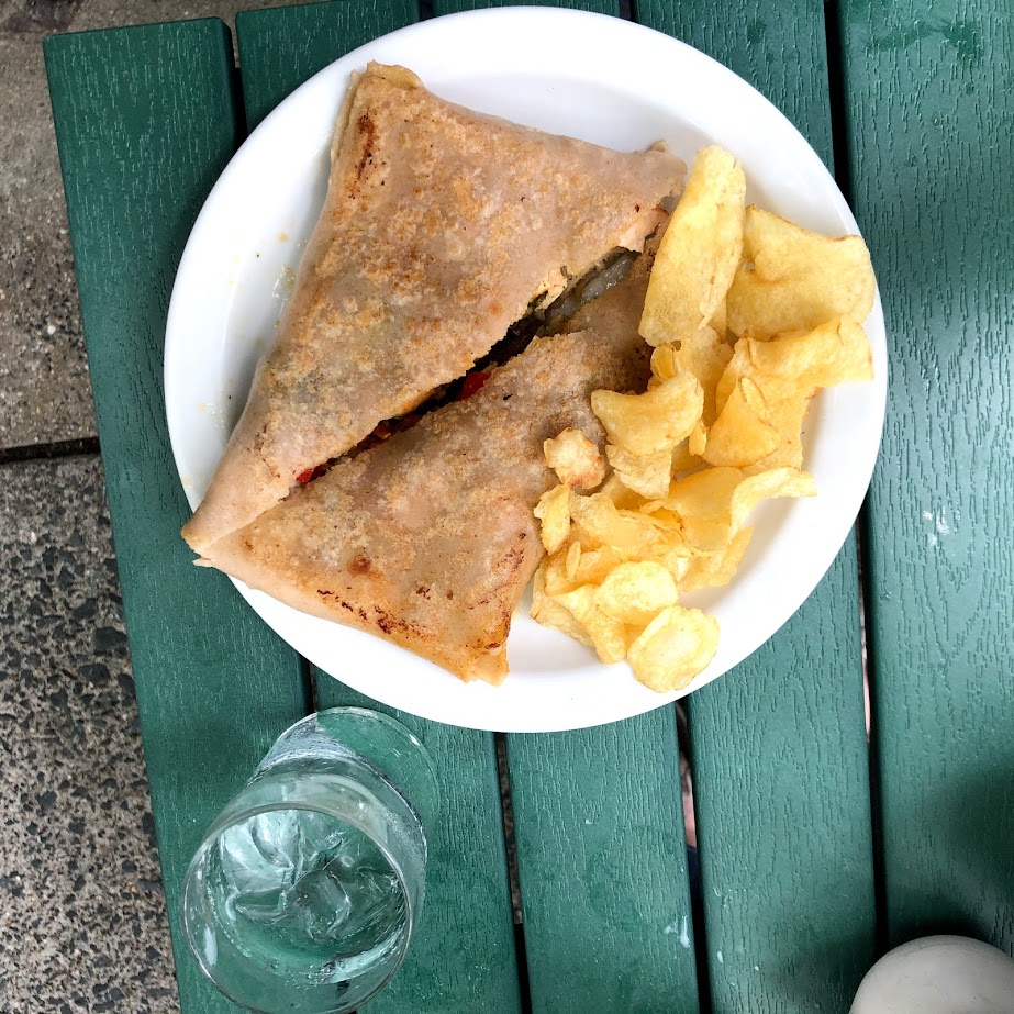 A gluten free crepe with a side of potato chips from The Whistling Kettle restaurant in Troy, New York