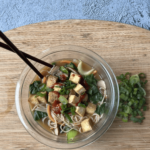 bowl of gluten free ramen noodle soup topped with tofu Gojuchang and green onions
