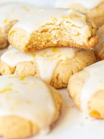 gluten free dairy free almond lemon cookies with lemon glaze stacked