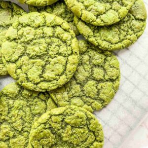 gluten free vegan matcha cookies stacked on parchment