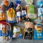 image of 9 loaves of gluten free sandwich bread from popular brands on concrete