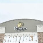 front of panera bread store with snow on awnings