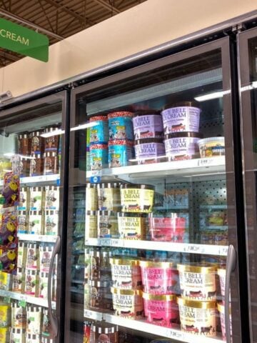 containers of blue bell ice cream in the freezer at publix grocery store