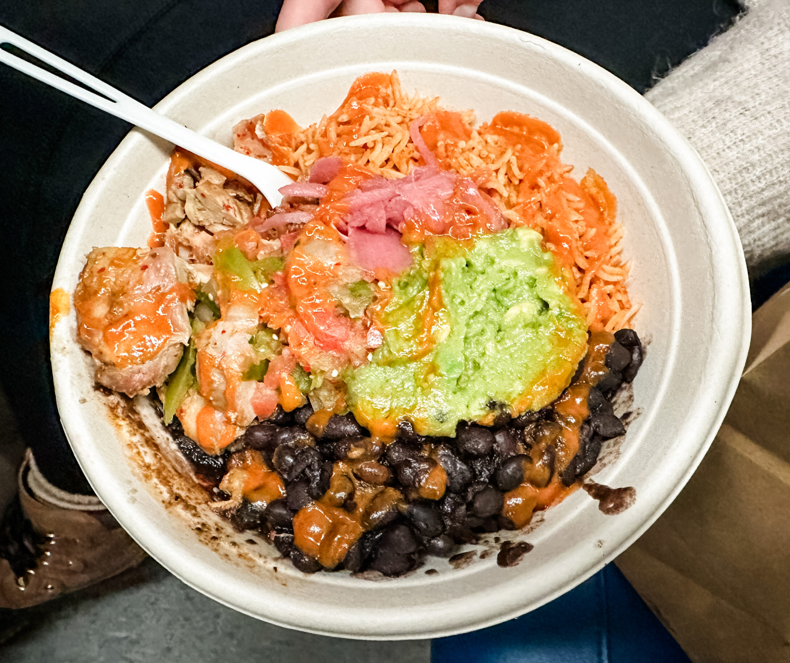 Gluten Free Mexican Bowl from Springbone Kitchen in NYC, made with free-range chicken, spanish bone broth rice, black beans, guacamole, pico de gallo, pickled onion and hot sauce