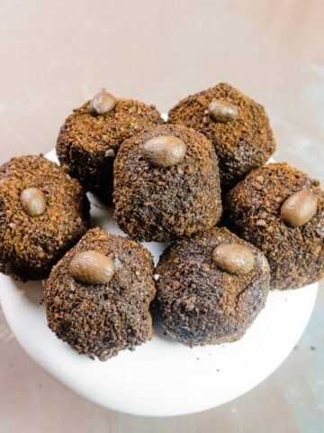 homemade gluten free mocha espresso truffles on a white dessert stand
