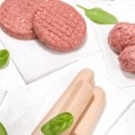 gluten free plant based hamburgers meatballs and hot dogs on white background