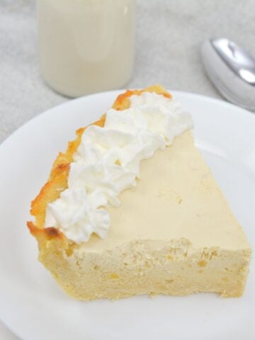 slice of low carb sugar free gluten free root beer float pie on white plate with spoon