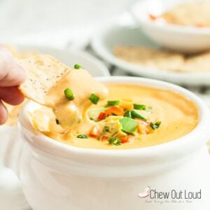 nacho queso dip with tortilla chip