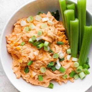 easy buffalo chicken dip in bowl with celery