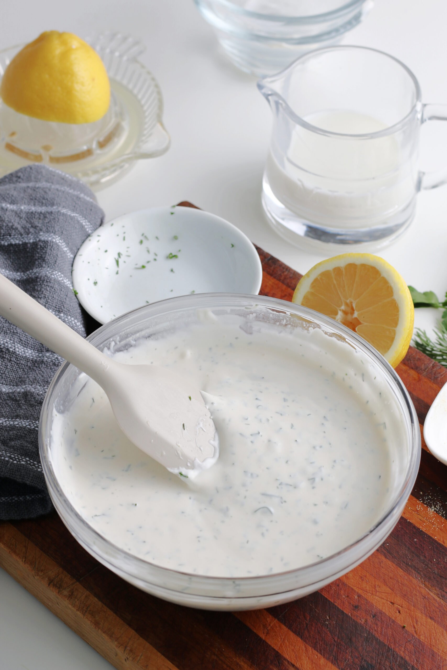 All of the ingredients have been mixed together, and the bowl is filled with ranch dressing.